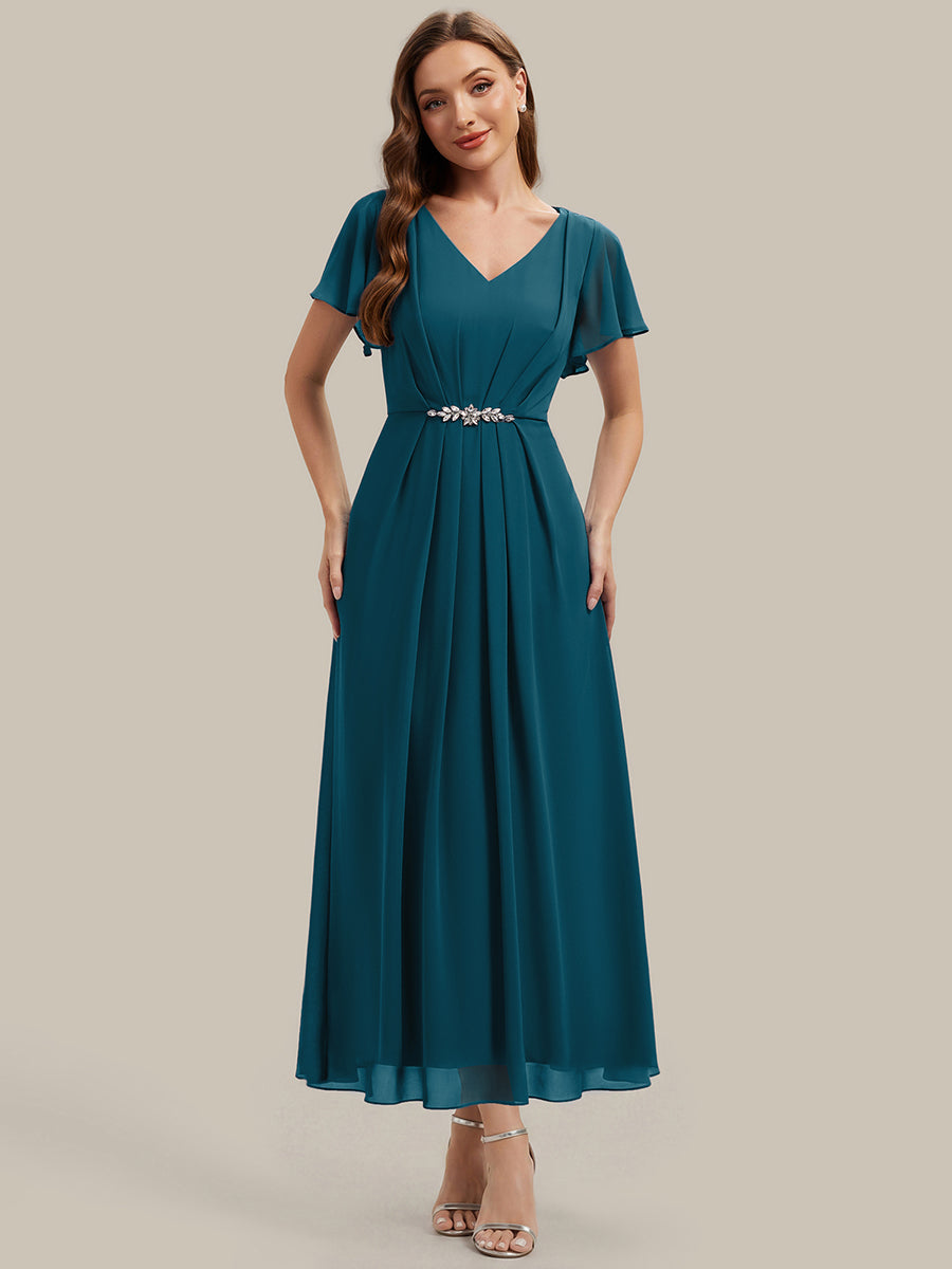 Robe longue maxi ligne A avec manches à volants col en V ornée de strass #Couleur_Bleu Sarcelle