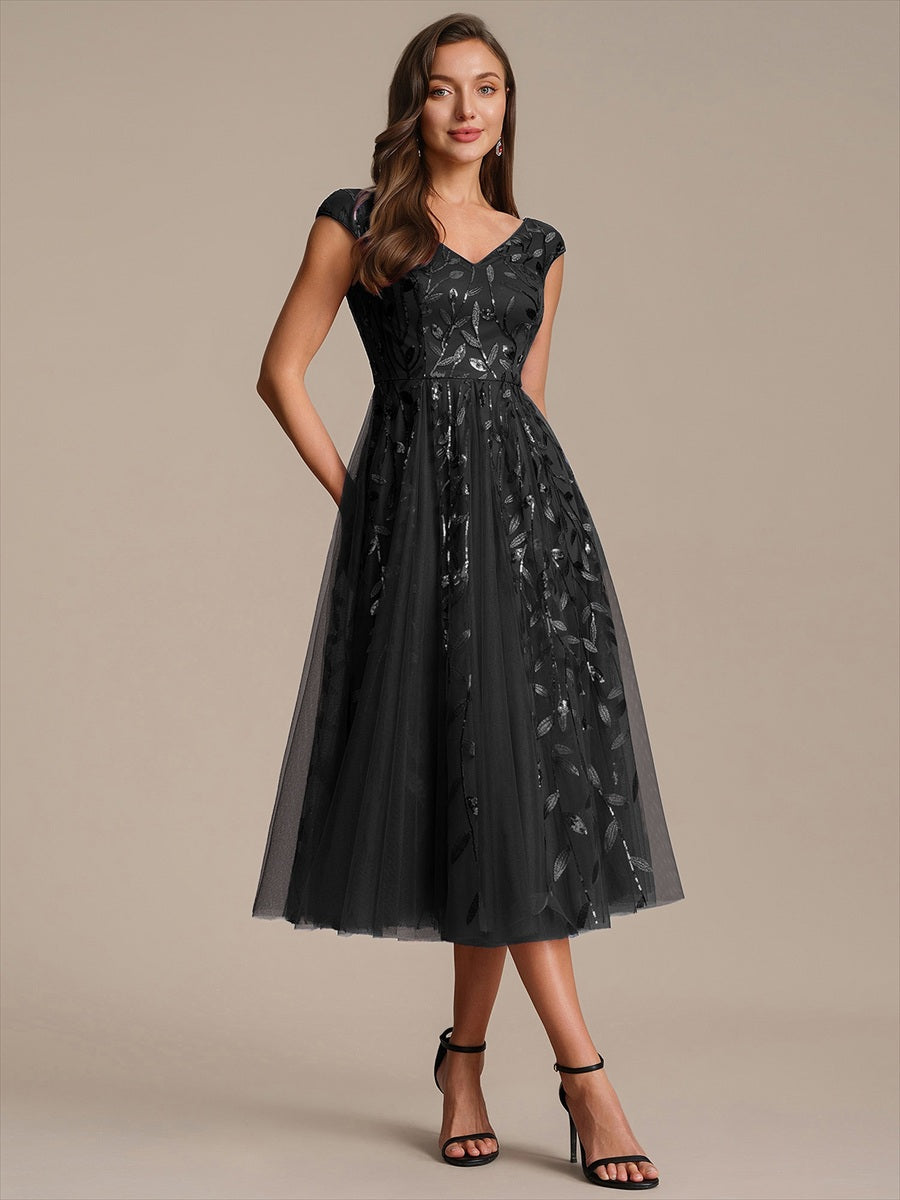 Robe midi sans manches col en V à sequins et coupe évasée #Couleur_Noir
