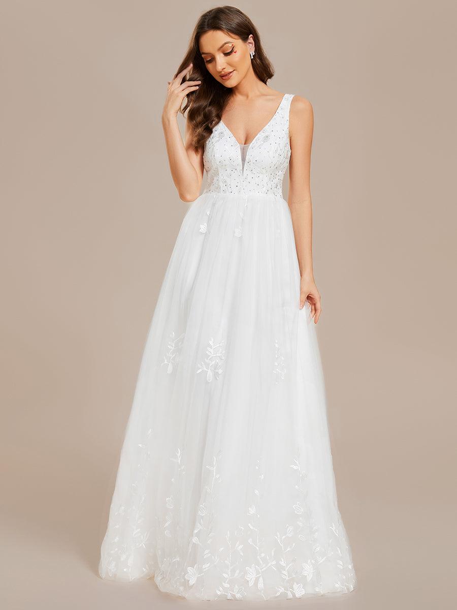 Robe de mariée trapèze brodée sans manches à col en V #Couleur_Blanc Robe de mariée trapèze brodée sans manches à col en V