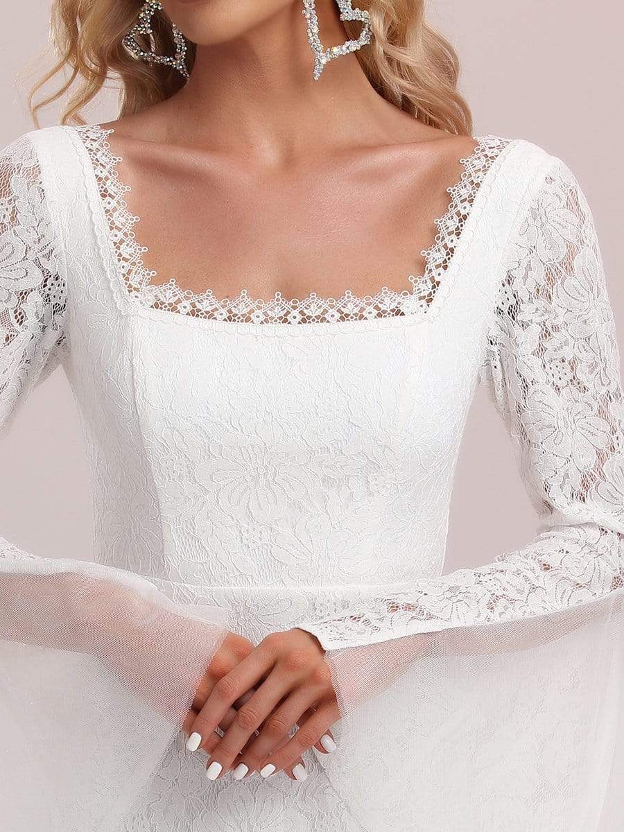 Robe de mariée fendue à manches longues et poignets cloche #Couleur_Blanc Robe de mariée fendue à manches longues et poignets cloche