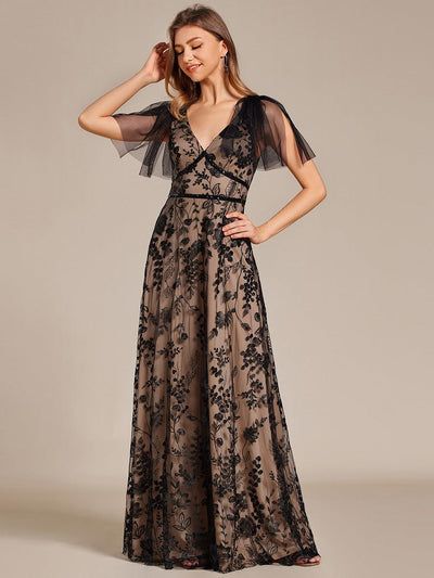 Robe longue de soirée en maille brodée à manches évasées