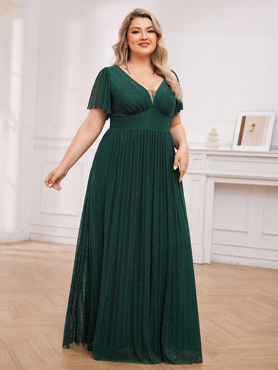 Robe de soirée transparente scintillante col en V taille empire manches courtes