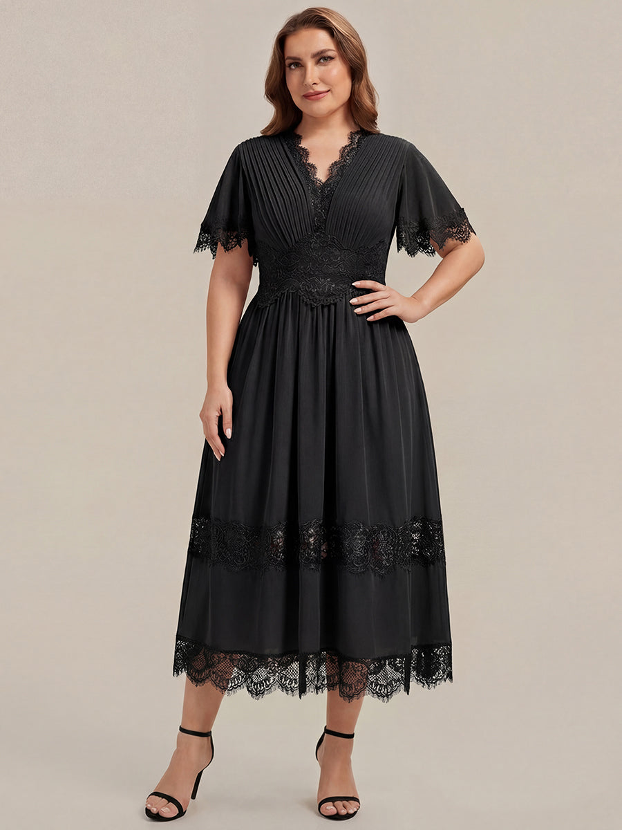 Robe midi A ligne à manches courtes plissée décolletée en V avec manches volantées et détail découpé #Couleur_Noir