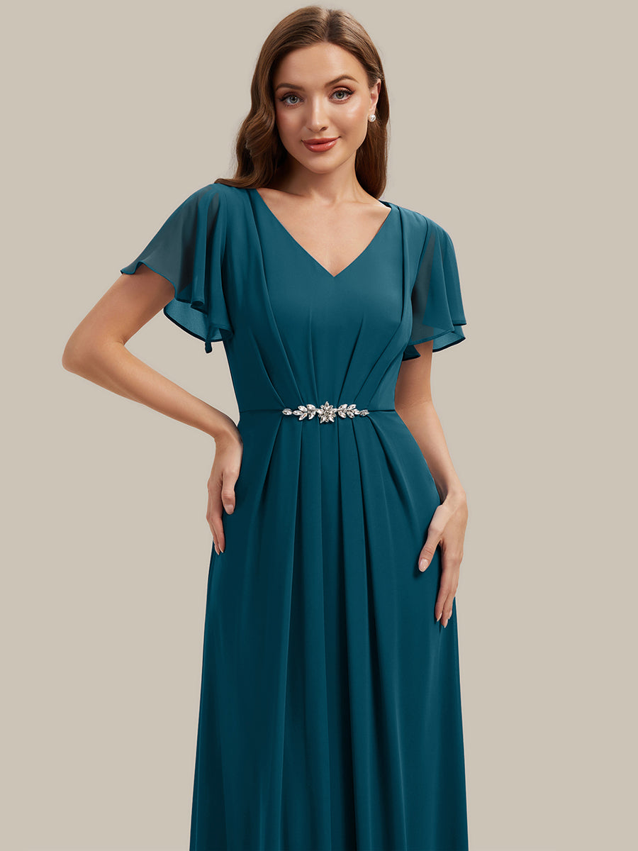 Robe longue maxi ligne A avec manches à volants col en V ornée de strass #Couleur_Bleu Sarcelle