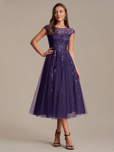 Robe de soirée mi-longue à paillettes avec manches cape