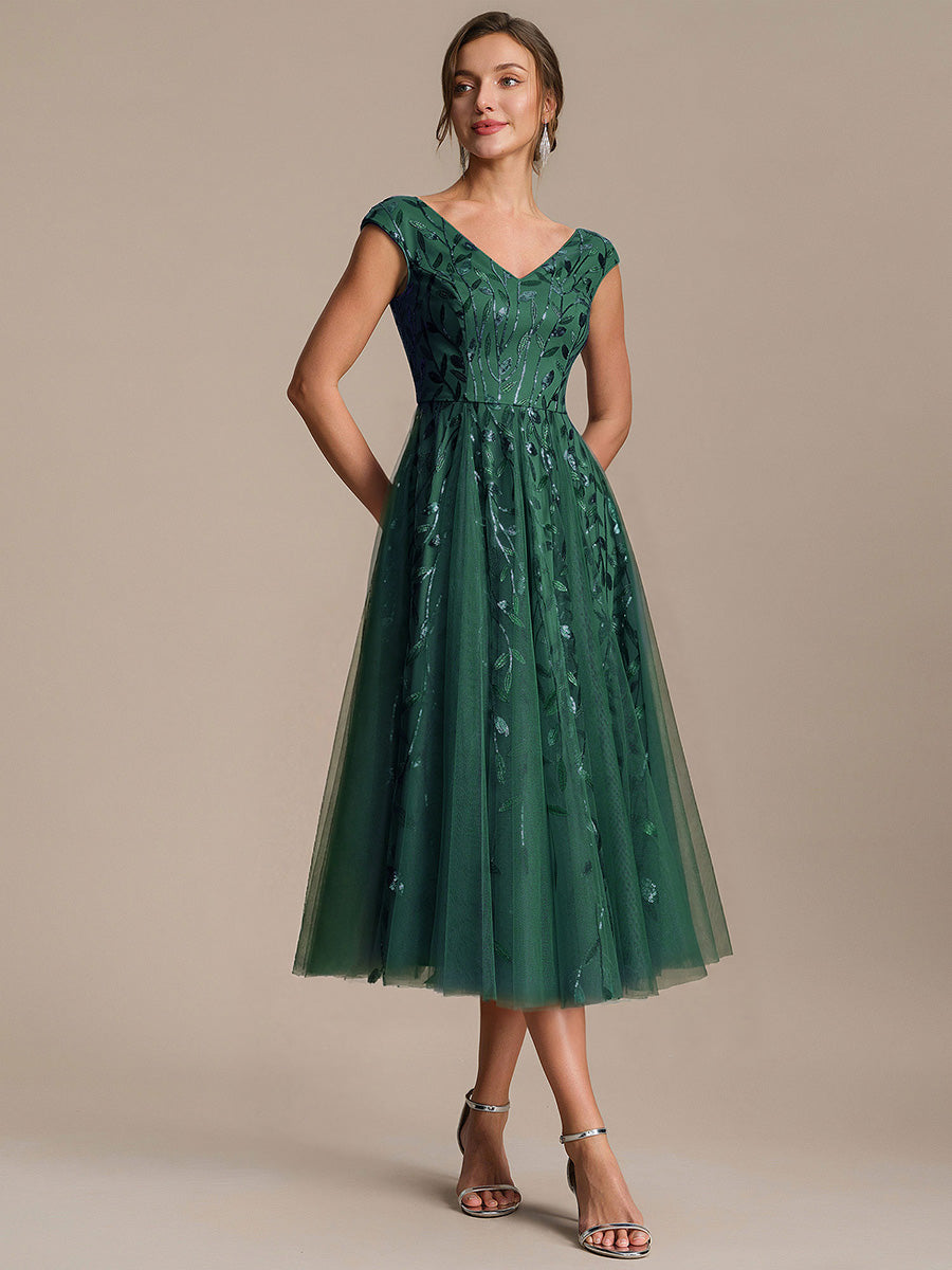 Robe midi sans manches col en V à sequins et coupe évasée #Couleur_Vert Fonce