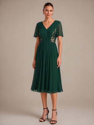 Robe midi plissée en mousseline à manches volantées