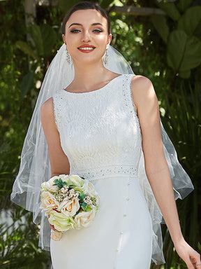 Robe de mariée en queue de poisson fendue sur le côté en dentelle florale sans manches