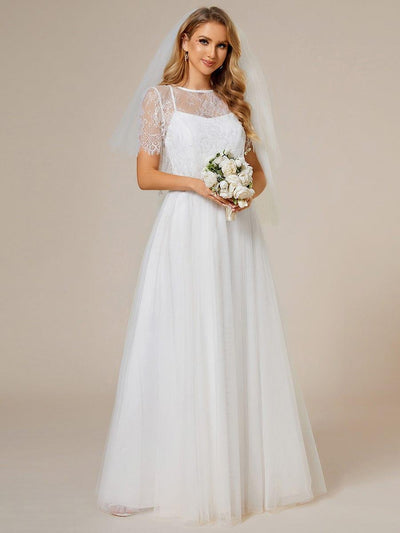 Robe de mariée trapèze avec veste en dentelle et bretelles spaghetti