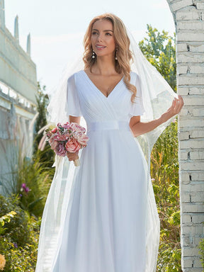 Maxi robe de mariée minimaliste en mousseline de soie avec ceinture en satin